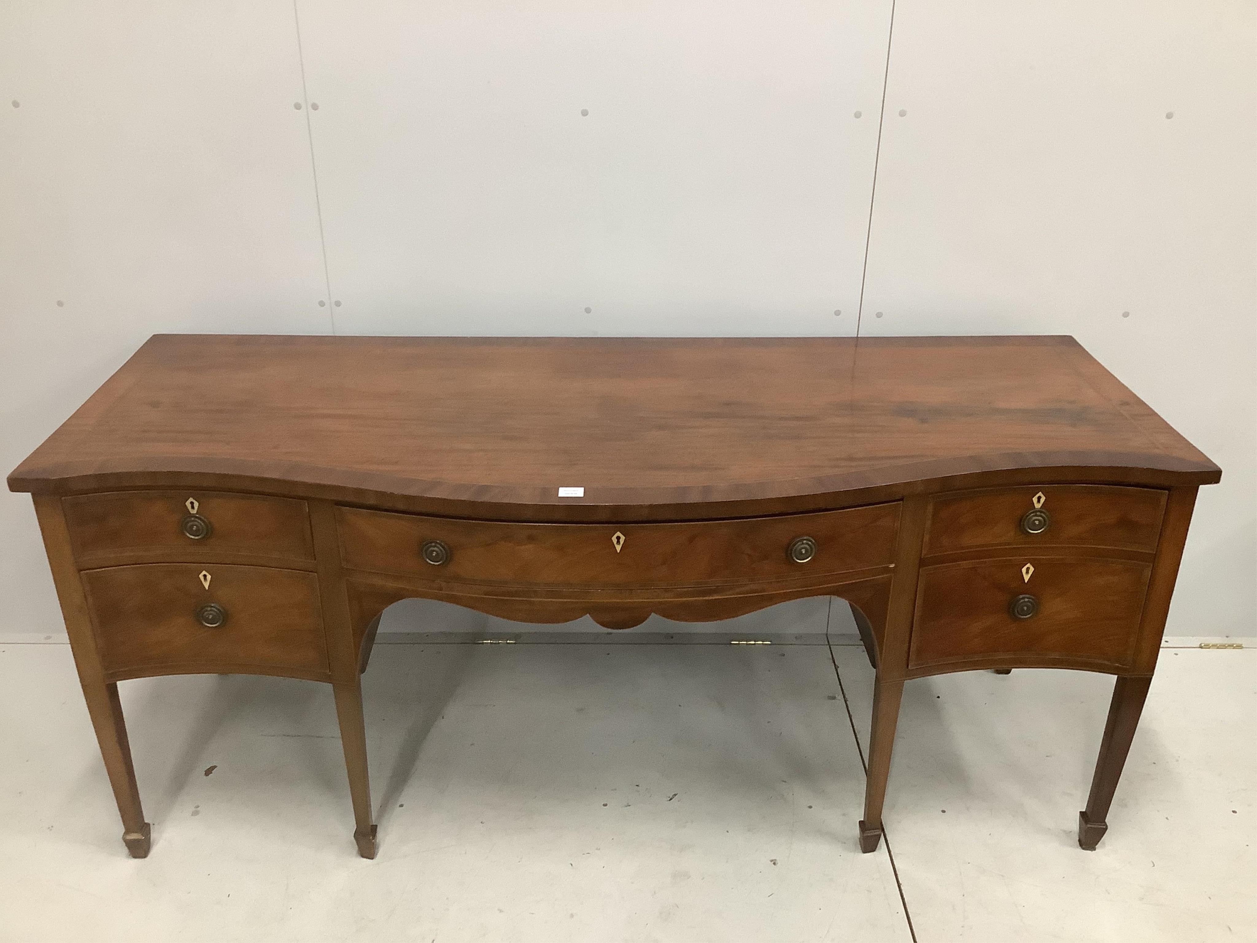 A George III serpentine mahogany sideboard, width 202cm, depth 79cm, height 87cm. Condition - fair